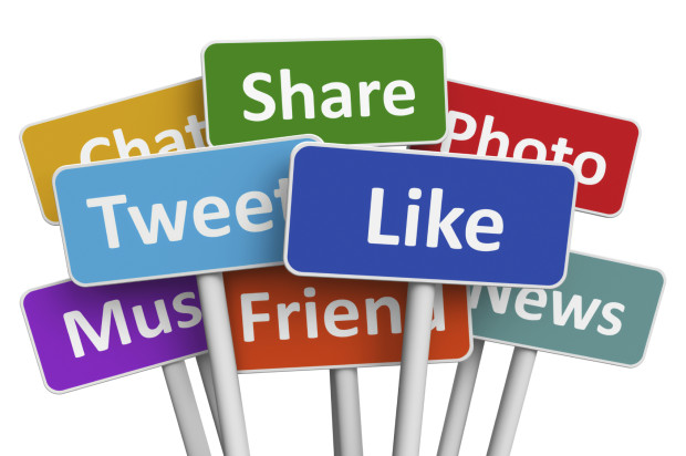 Signs showing social media engagement including Tweet, Like, Share, and Chat